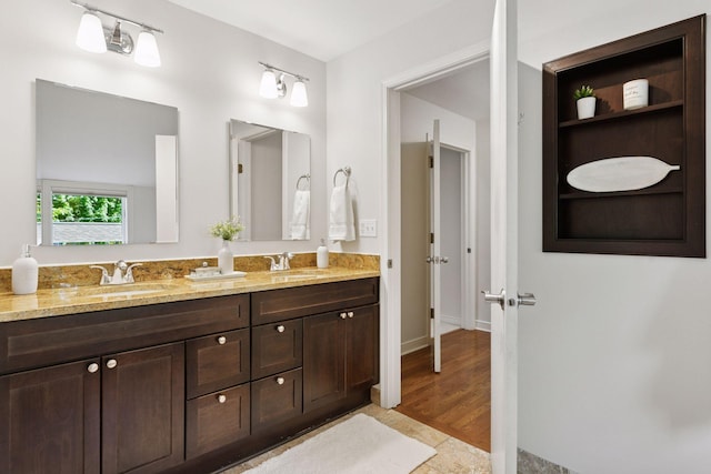 1215 Eleanor Ave, Saint Paul, MN 55116 - bathroom featuring double vanity and baseboards