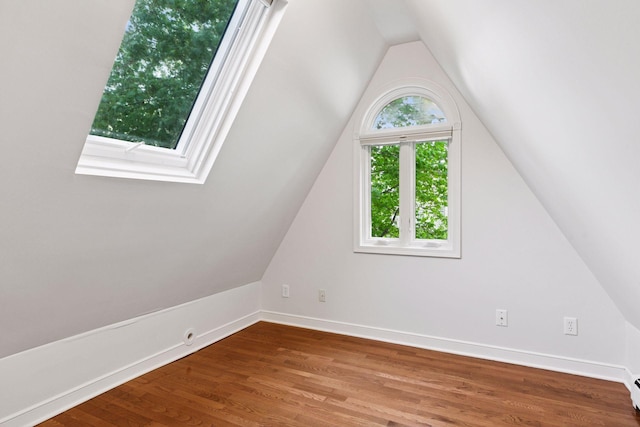 1215 Eleanor Ave, Saint Paul, MN 55116 - additional living space with lofted ceiling, wood finished floors, and baseboards