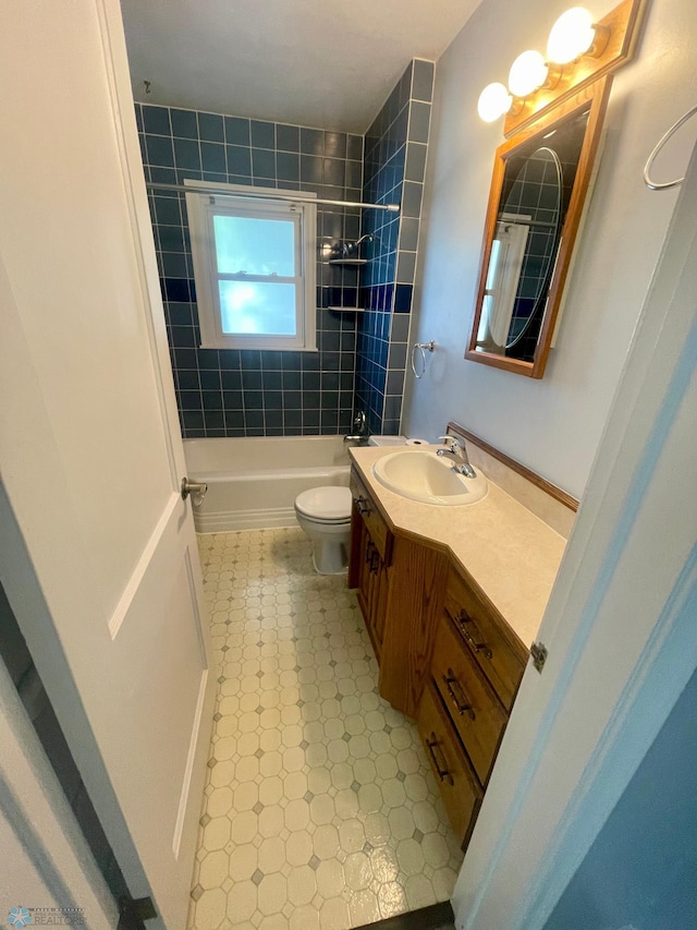 1630 7th St N, Fargo, ND 58102 - full bath with vanity, toilet, tile patterned floors, and  shower combination