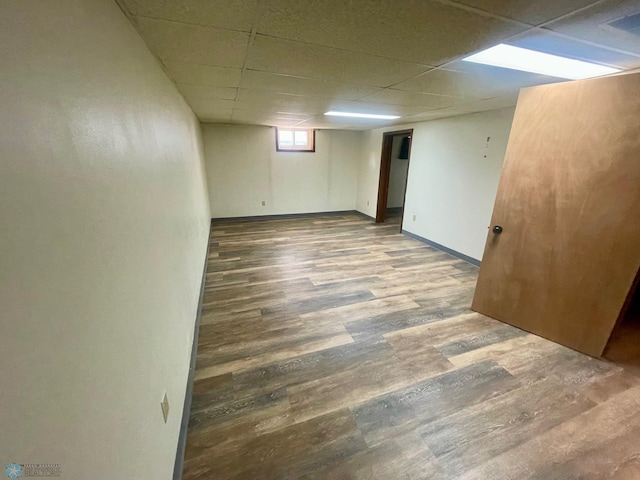 1630 7th St N, Fargo, ND 58102 - basement featuring a drop ceiling, wood finished floors, and baseboards