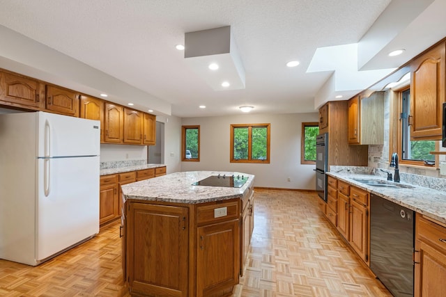 4306 Woods Way, Minnetonka, MN 55345 - kitchen featuring black appliances, a sink, a kitchen island, brown cabinetry, and light stone countertops