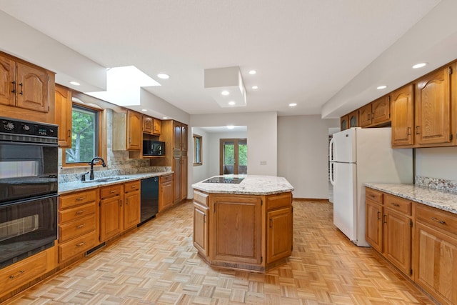 4306 Woods Way, Minnetonka, MN 55345 - kitchen with a sink, black appliances, a center island, recessed lighting, and decorative backsplash