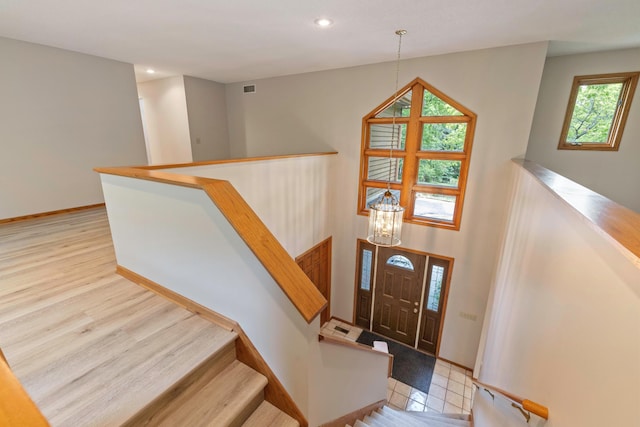 4306 Woods Way, Minnetonka, MN 55345 - foyer entrance with recessed lighting, baseboards, a chandelier, and light wood-type flooring