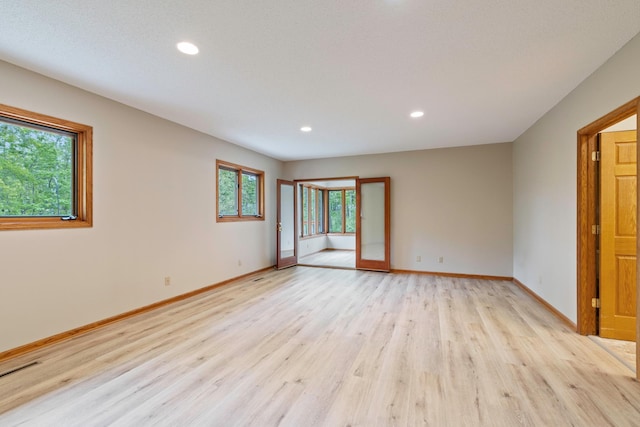 4306 Woods Way, Minnetonka, MN 55345 - unfurnished room with light wood finished floors, recessed lighting, and baseboards