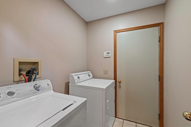 4306 Woods Way, Minnetonka, MN 55345 - laundry area with washing machine and dryer and light tile patterned floors