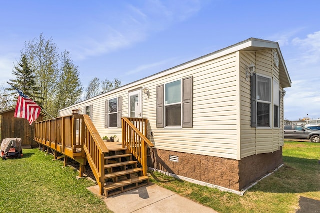 3908 Brian St, Duluth, MN 55803 - back of house with crawl space, a lawn, and a deck