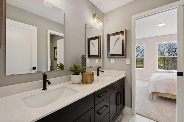 15630 112th St, Dayton, MN 55369 - full bathroom featuring double vanity, baseboards, marble finish floors, and ensuite bath