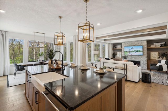 15630 112th St, Dayton, MN 55369 - kitchen with a sink, light wood finished floors, a kitchen island with sink, decorative light fixtures, and recessed lighting