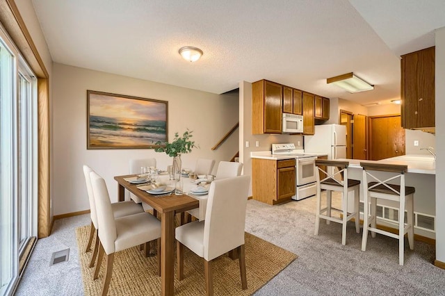 7293 Savanna Ct, Lino Lakes, MN 55014 - dining space featuring light colored carpet and baseboards
