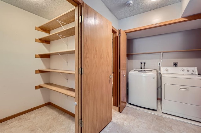 7293 Savanna Ct, Lino Lakes, MN 55014 - laundry room with a textured ceiling and washer and dryer