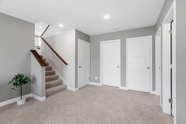736 Blackbird Cir, Delano, MN 55328 - below grade area with carpet, baseboards, recessed lighting, and stairway