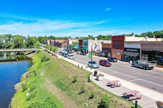 736 Blackbird Cir, Delano, MN 55328 - view of asphalt street featuring sidewalks, street lights, curbs, and a water view