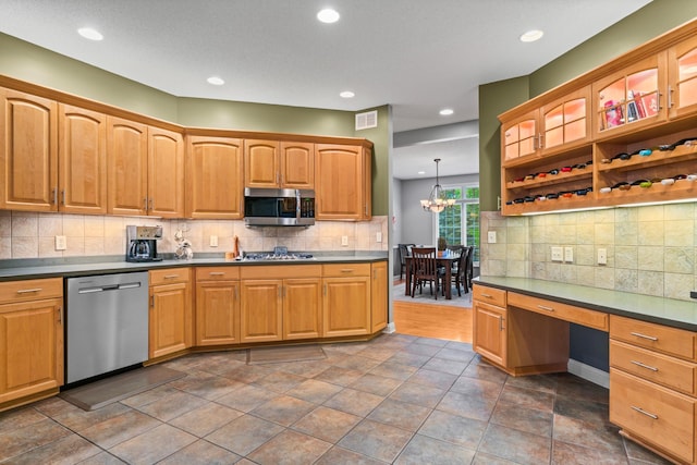 2508 4th Ave NW, Austin, MN 55912 - kitchen with appliances with stainless steel finishes, dark countertops, tasteful backsplash, and recessed lighting