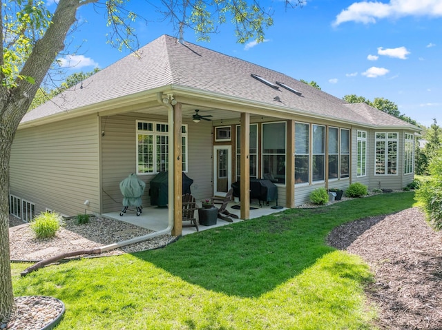 2508 4th Ave NW, Austin, MN 55912 - back of property featuring a patio, a lawn, a ceiling fan, and roof with shingles