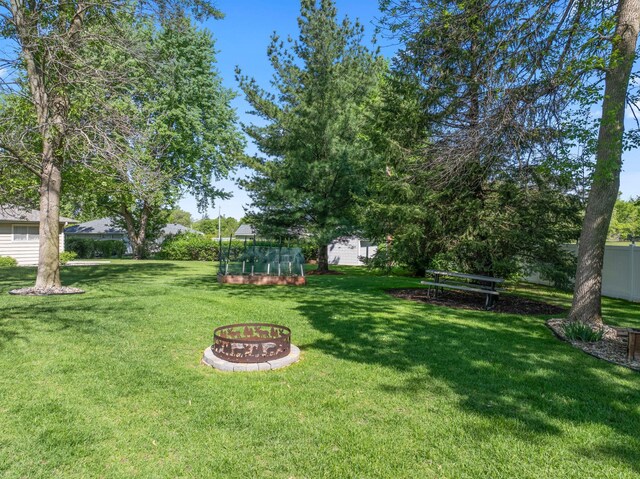 2508 4th Ave NW, Austin, MN 55912 - view of grassy yard featuring an outdoor fire pit