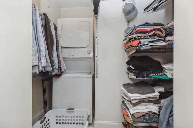 3520 Emerson Ave S Unit 202, Minneapolis, MN 55408 - laundry area featuring estacked washer and dryer and baseboards
