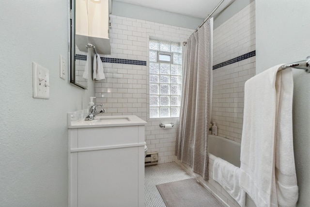 3520 Emerson Ave S Unit 202, Minneapolis, MN 55408 - bathroom with vanity, shower / tub combo with curtain, tile walls, and tile patterned flooring