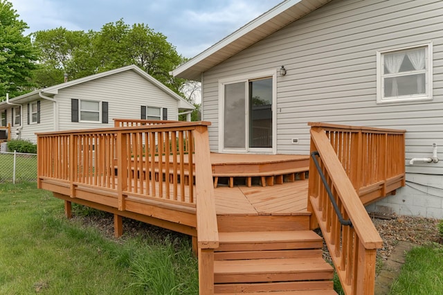 wooden terrace featuring fence