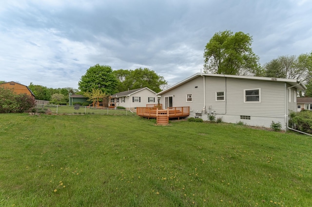 rear view of property featuring a deck