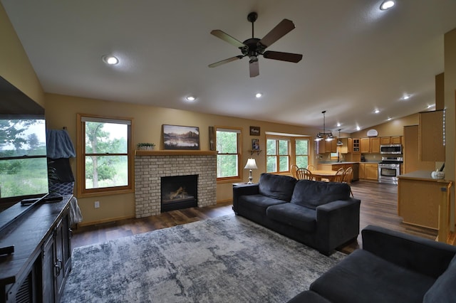 4741 Briarwood Ln, Baxter, MN 56425 - living room with ceiling fan, dark wood-type flooring, vaulted ceiling, recessed lighting, and a brick fireplace