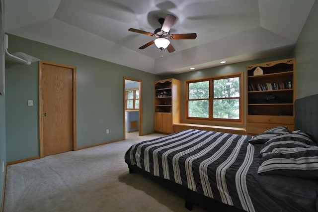 4741 Briarwood Ln, Baxter, MN 56425 - bedroom featuring a tray ceiling, light colored carpet, multiple windows, recessed lighting, and ceiling fan