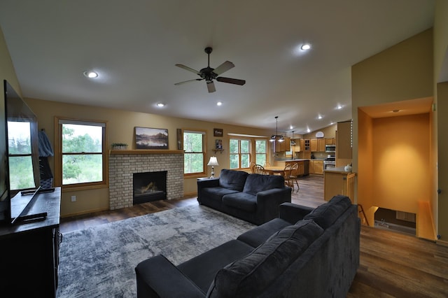 4741 Briarwood Ln, Baxter, MN 56425 - living area featuring ceiling fan, dark wood-style flooring, lofted ceiling, a fireplace, and recessed lighting