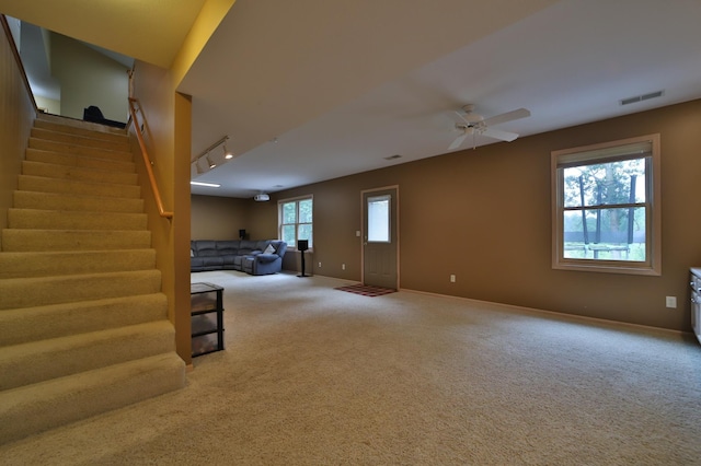 4741 Briarwood Ln, Baxter, MN 56425 - unfurnished living room featuring carpet, a ceiling fan, and stairway