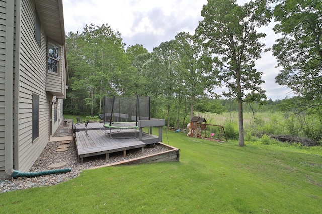 4741 Briarwood Ln, Baxter, MN 56425 - view of grassy yard with a playground, a trampoline, and a deck