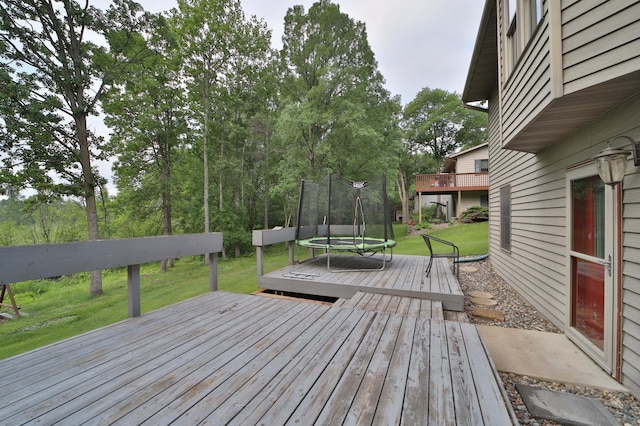 4741 Briarwood Ln, Baxter, MN 56425 - wooden deck with a trampoline and a yard