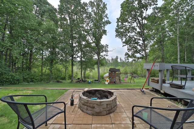 4741 Briarwood Ln, Baxter, MN 56425 - view of patio featuring a fire pit and a playground