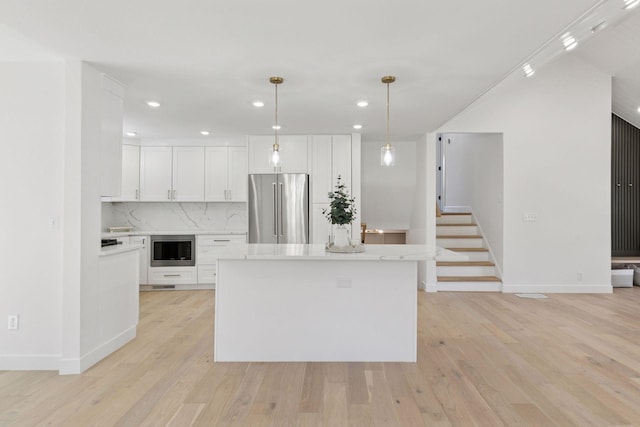 1022 Fairview Ave S, Saint Paul, MN 55116 - kitchen featuring stainless steel appliances, light countertops, white cabinetry, recessed lighting, and decorative backsplash