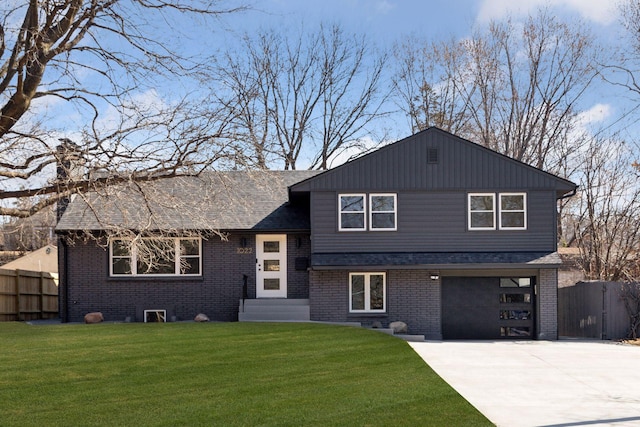 1022 Fairview Ave S, Saint Paul, MN 55116 - tri-level home with brick siding, driveway, an attached garage, and entry steps