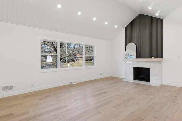 1022 Fairview Ave S, Saint Paul, MN 55116 - unfurnished living room with recessed lighting, light wood finished floors, a high end fireplace, baseboards, and high vaulted ceiling