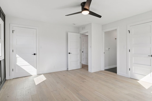 1022 Fairview Ave S, Saint Paul, MN 55116 - unfurnished bedroom with light wood-style flooring, baseboards, and ceiling fan