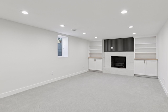 1022 Fairview Ave S, Saint Paul, MN 55116 - unfurnished living room featuring baseboards, light carpet, recessed lighting, and a large fireplace