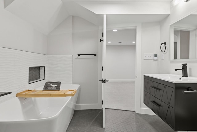 1022 Fairview Ave S, Saint Paul, MN 55116 - bathroom featuring a soaking tub, vanity, tile patterned floors, baseboards, and recessed lighting