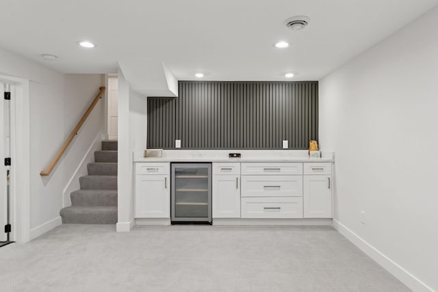 1022 Fairview Ave S, Saint Paul, MN 55116 - indoor bar with wine cooler, light colored carpet, baseboards, and recessed lighting