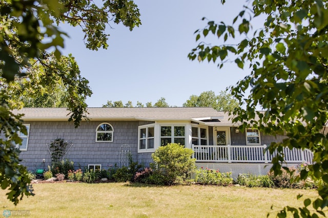28040 Anchor Rd, Detroit Twp, MN 56501 - view of front of home with a front lawn and a wooden deck