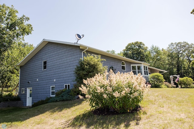 28040 Anchor Rd, Detroit Twp, MN 56501 - view of side of property featuring a lawn
