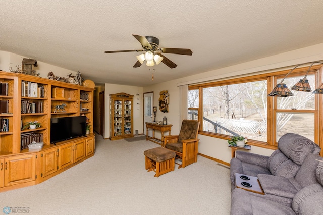 28040 Anchor Rd, Detroit Twp, MN 56501 - living area featuring a ceiling fan, light carpet, baseboards, and a textured ceiling
