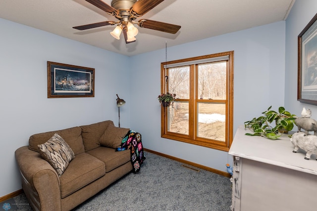 28040 Anchor Rd, Detroit Twp, MN 56501 - carpeted living room featuring baseboards and ceiling fan