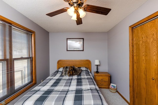 28040 Anchor Rd, Detroit Twp, MN 56501 - carpeted bedroom featuring a textured ceiling, ceiling fan, and baseboards