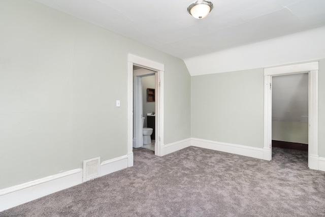1430 Penn Ave N, Minneapolis, MN 55411 - unfurnished room featuring carpet, vaulted ceiling, and baseboards