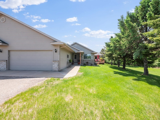 509 Kinkead Dr NW, Alexandria, MN 56308 - view of front of home with gravel driveway, a front yard, brick siding, and an attached garage