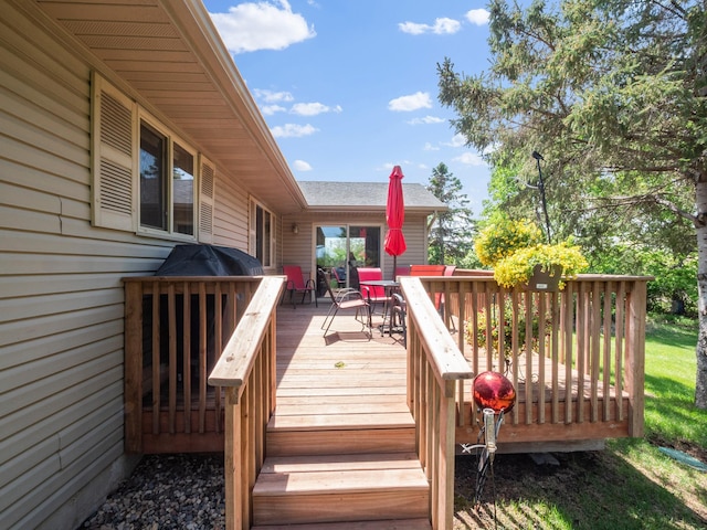 509 Kinkead Dr NW, Alexandria, MN 56308 - wooden deck with outdoor dining space