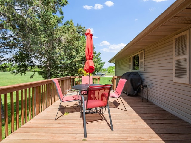 509 Kinkead Dr NW, Alexandria, MN 56308 - deck with outdoor dining space, a lawn, and grilling area