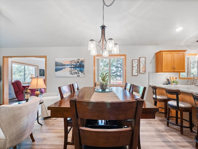 509 Kinkead Dr NW, Alexandria, MN 56308 - dining area featuring a chandelier, light wood finished floors, plenty of natural light, and recessed lighting
