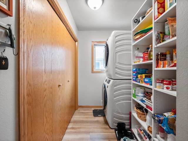 509 Kinkead Dr NW, Alexandria, MN 56308 - clothes washing area with stacked washer and clothes dryer and wood finished floors