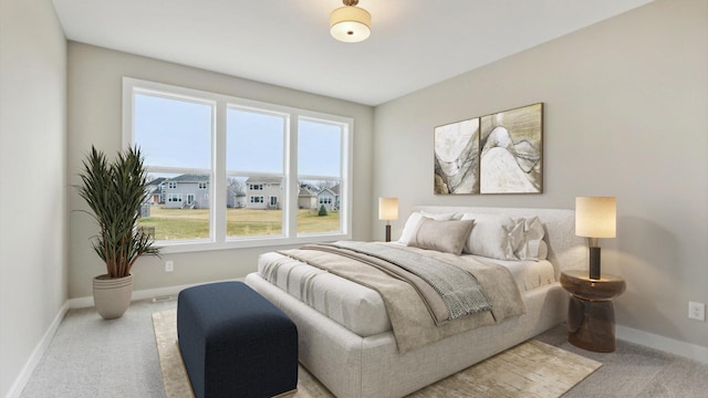 bedroom featuring carpet floors and baseboards