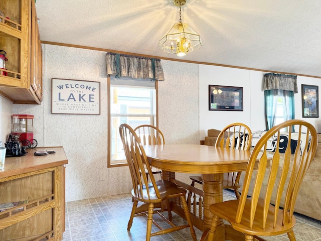 20429 326th Ave Unit 15, Isle, MN 56342 - dining space featuring wallpapered walls, ornamental molding, a textured ceiling, a chandelier, and brick patterned floors